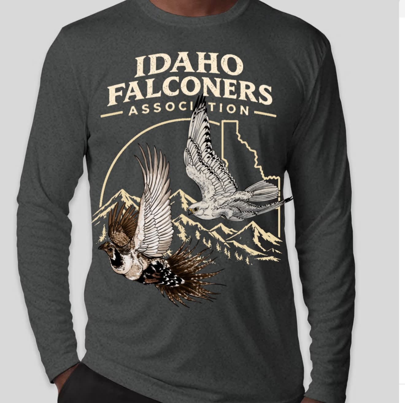 2026 Idaho Falconers Association Fall Meet shirt featuring a peregrine falcon and chukar